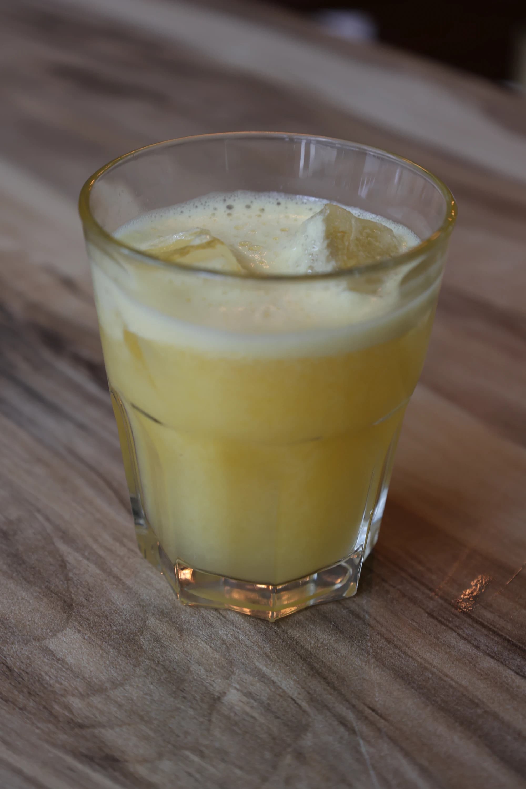 classic mango smoothie served in a chilled glass